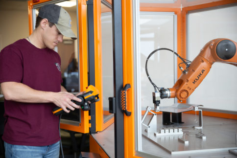 male student with machinery