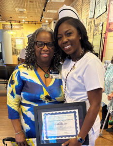 Shanelle holding degree with instructor